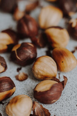  nuts and cacao powder on grey background