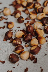 Fototapeta premium nuts and cacao powder on grey background