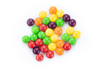The multicolor flavored fruit candies on white background. - obrazy, fototapety, plakaty