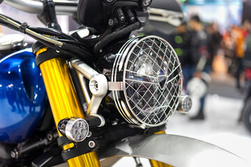 Close up shot of a vintage motorcycle headlight.