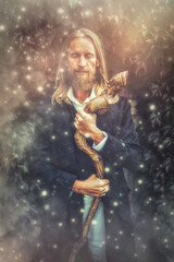 Alchemist in a beautiful ornamental dress in nature.