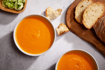 Bowl of homemade carrot and pumpkin soup