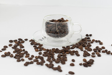 Coffee beans on a white background. Cup of coffee beans.