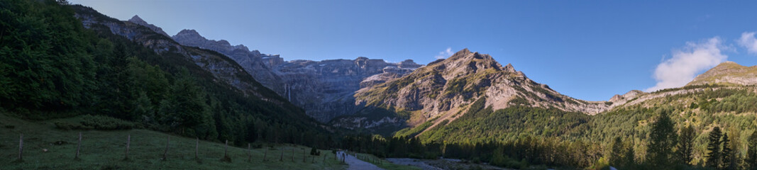 Panoramic view of the Cirque de Gavarnie with the first rays of the sun, Monte Perdido massif. France, Occitanie, Hautes Pyrenees