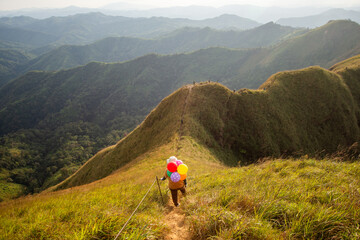 Obraz premium hiking group on mountain at Khao Chang Phueak, Thongphaphoom National Park, Kanchanaburi Province, Thailand. Subject is blurred, noise and vintage tone.