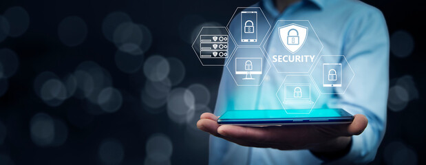 Man using security system in tablet.