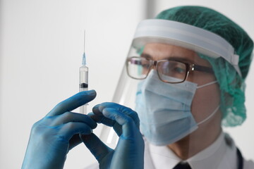Professional medical doctor in hospital office. Portrait of young and confident physician. Medical...