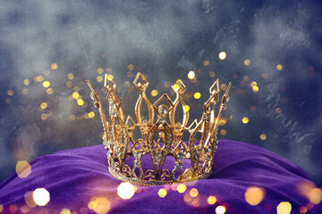 Golden queen crown over mysterious dark background. Mythical or fantasy world concept - 485298389