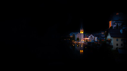 Fototapeta na wymiar Scenic picture-postcard view of famous Hallstatt mountain village in the Austrian Alps, Salzkammergut region, Hallstatt, Austria. Hallstatt village on Hallstatter lake in Austrian Alps at night.
