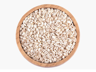 Heap of pearl barley isolated on white