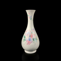 antique crockery for table setting. vintage porcelain vase with flower pattern on black isolated background