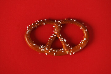 Red background with traditional German bretzel	