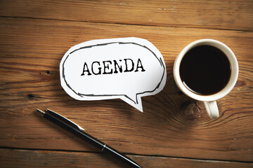 agenda text on paper with coffee