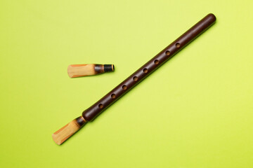 Armenian national musical instrument duduk on color background. Top view