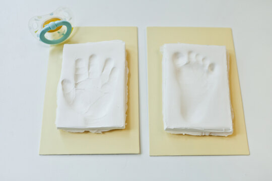 Baby footprint and handprint clay mold To remember in the future how small the baby was in childhood