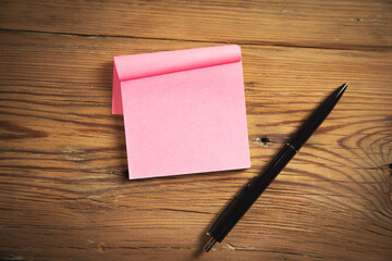 Adhesive paper with pen.