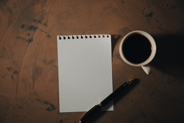 empty paper with cup of coffee on table
