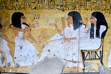 A colorful mural from the tomb Inkherkhau (TT350) on the West Bank of Nile - Thebes, Luxor, Egypt, depicting funerary rituals performed for the deceased and his wife -  censing and libation