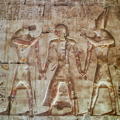 A Wall Carving of the temple of Seti I in Abydos, with gods Anubis and Horus