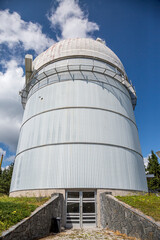 Small astronomical observatory with telescope in Bulgarian mountains at the sunset.