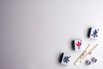 Fototapeta na wymiar Mahjong. Riichi Mahjong set for playing. Space for text.