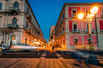 Fototapeta na wymiar Long night exposure with people and traffic, city of Taranto
