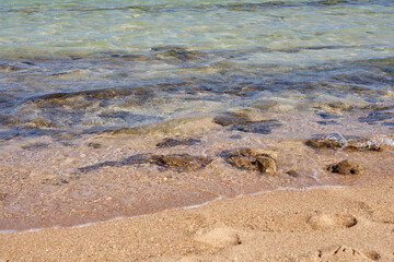 Waves on the tropical sandy beach of the red sea.