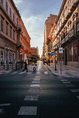 Fototapeta na wymiar Man crossing the road in the centre of Taranto