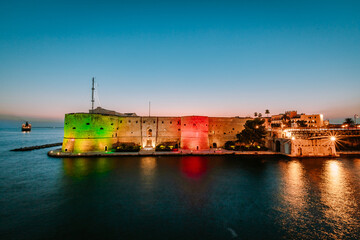 Aragonese Castle of Taranto illuminated at sunset in summer