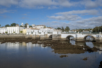 seven-arched Roman Bridge over the Gilão River in Tavira, Algarve / Portugal