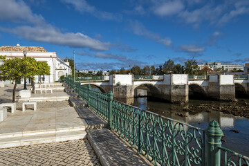 seven-arched Roman Bridge over the Gilão River in Tavira, Algarve / Portugal