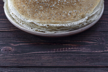 Russian pancakes on a wooden dark background Maslenitsa holiday, pancakes week. traditional slavic festival meal.