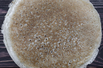 Russian pancakes on a wooden dark background Maslenitsa holiday, pancakes week. traditional slavic festival meal.