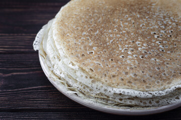 Russian pancakes on a wooden dark background Maslenitsa holiday, pancakes week. traditional slavic festival meal.