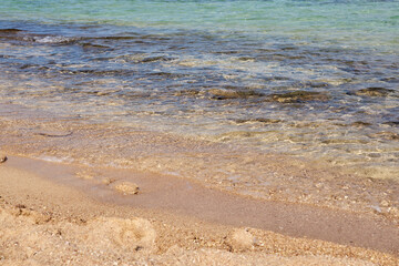 Waves on the tropical sandy beach of the red sea.