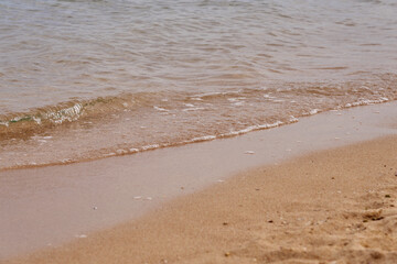 Waves on the tropical sandy beach of the red sea.