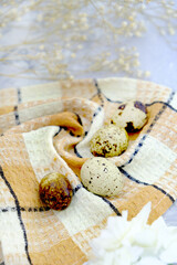 Quail eggs on wooden background. Happy Easter