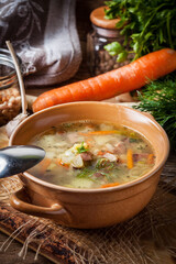 Pea soup with vegetables and bacon.