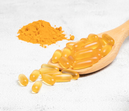 Alternative natural medicine. Omega 3 and Turmeric. Superfood, detox or diet concept. Background layout with free text space. Stock photo.
