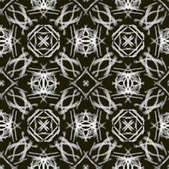 Seamless geometric pattern of mandalas, flowers. A white ornament on a black background, hand-drawn. Retro style. Design of the background, interior,wallpaper, textiles, fabric, packaging.
