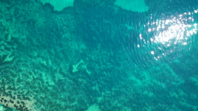 Surface of Ionian Sea in Benitses resort village on Corfu Island, Greece