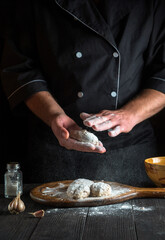 Cook prepares cutlets before frying in the restaurant kitchen. The idea of making a delicious lunch or dinner