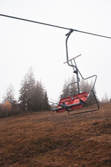 Fototapeta premium A ski lift is a mechanism for transporting skiers up a hill. Ski lifts are typically a paid service at ski resorts.