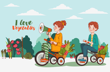 Cute boy and girl with fresh vegetables rides on bicycle in the garden. Funny girl shouting on the megaphone. Summer time

