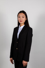 Portrait of a serious young asian business woman wearing a suite costume