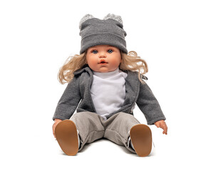 Little plastic doll baby girl isolated on white background.