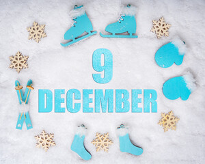 December 9th. Sports set with blue wooden skates, skis, sledges and snowflakes and a calendar date....