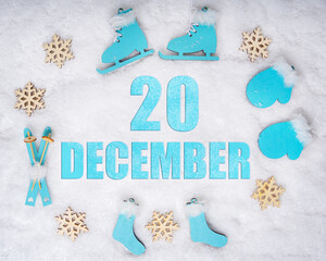 December 20th. Sports set with blue wooden skates, skis, sledges and snowflakes and a calendar date. Day 20 of month.