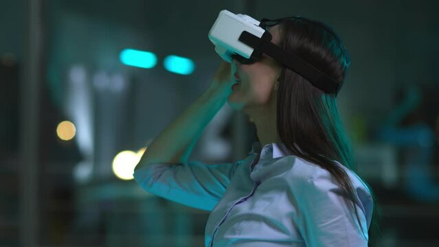 Businesswoman wearing vr headset working in office