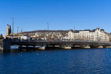 Fototapeta premium Cityscape of the old town of Zürich with lake Zürich in the foreground on a sunny winter day. Photo taken February 5th, 2022, Zurich, Switzerland.
